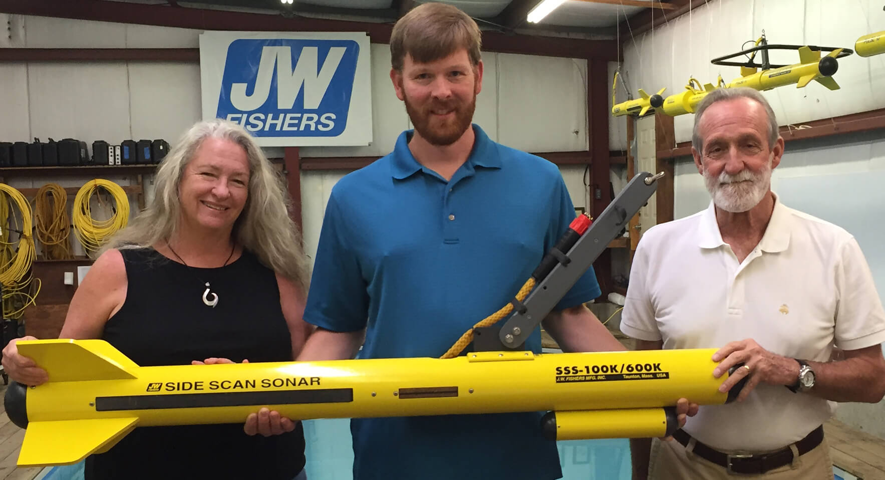 Dr. Laurel Harrison Breece with sonar tech Brian Awalt (c) and husband and colleague Dr. Bill Breece and the new JW Fishers SSS-100K/600K side scan acquired by Long Beach City College for their marine archaeology program.