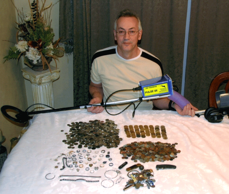 Laurent Lantigne with P8X and recovered coins and jewelry