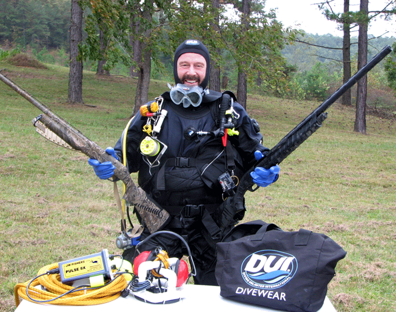 Peter Corbett, Divers Training & Supply with recovered shotguns