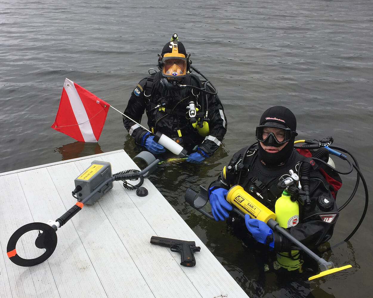 Divers holding Search And Recovery Metal Detector (SAR)
